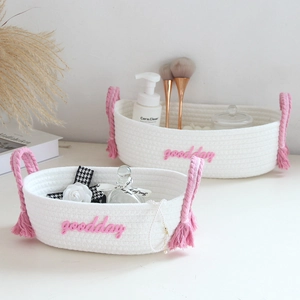 White handwoven cotton rope storage baskets with pink handles and goodday embroidery