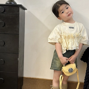 Kids cream round neck t-shirt with ruffle detail and denim shorts fashion set