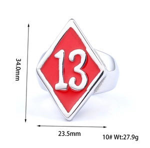 Detailed view of large stainless steel men's ring with red enamel and number 13