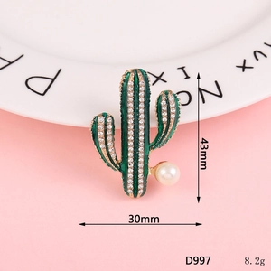 Golden cactus brooch with green enamel, sparkling rhinestones and a white pearl accent