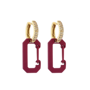 Detail of burgundy rectangular earrings with gold plated zircon studded huggie hoops