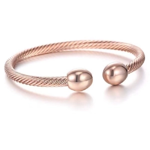 Rose gold open cable wire cuff bracelet with polished bead terminals on white background