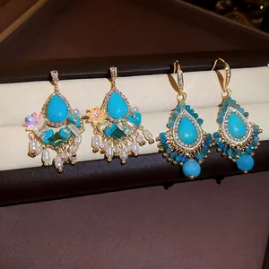 Elegant vintage turquoise and pearl tassel earrings with silver needle in gold finish