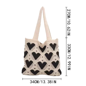Detailed size chart of knit heart tote bag showing dimensions in inches and centimeters