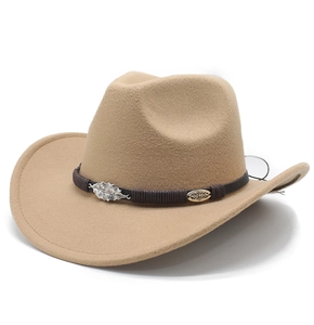 Close-up of a camel felt cowboy hat with a silver leaf metal accent on a woven band