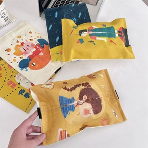 Detail view of cartoon canvas hanging tissue box covers with portable handles and hand-drawn art