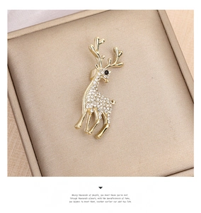 Detailed view of an elegant golden deer brooch featuring micro-set white cubic zirconia