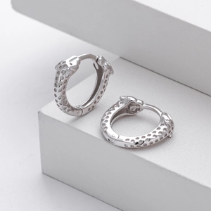 Detailed close-up of S925 sterling silver leopard head earrings with textured leopard print