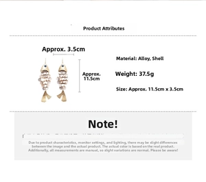 Detailed view of fish-shaped shell tassel earrings with size measurements in centimeters