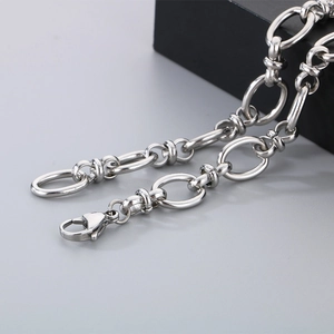 Detailed macro shot of vintage silver stainless steel thorny knot bracelet with lobster clasp