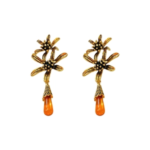 Vintage gold flower earrings with orange teardrop resin charms in a retro palace style