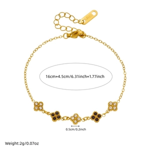 Gold stainless steel flower bracelet featuring sparkling crystals and black stone charms