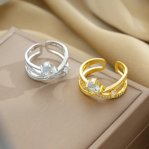Crossed multi-layer open rings in gold and silver finish with sparkling cubic zirconia