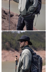 Detail view of wide brim sun hat and color-blocked hiking jacket for outdoor trekking
