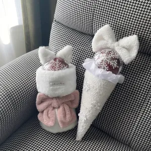 Christmas apple bouquet gift wrapping with white faux fur, plush fabric and pink bows