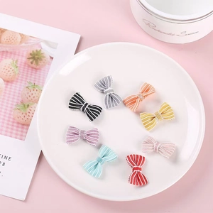 Set of eight assorted colorful striped ribbon bows for DIY plush toy doll accessories