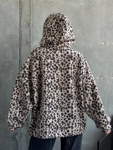 Back view of women's leopard print oversized hoodie showing soft fleece texture details