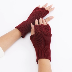 Detailed knit texture and ribbed cuff on these dark red fingerless knit gloves