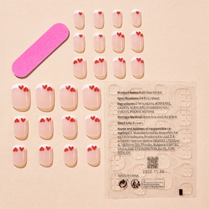 Press-on nail set with 16 red heart French tips, pink file, and 24 jelly glue tabs