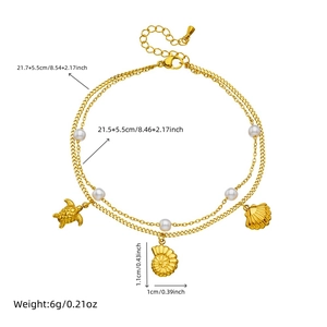 Double-layered gold anklet with white pearls, sea turtle and shell charms for beach style