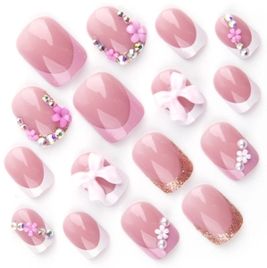 Pink French press-on nails with 3D flower rhinestone bow and pearl accents on white back