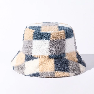 Detailed macro view of the checkered plush teddy fabric on a winter bucket hat