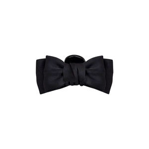 Elegant black satin bow hair claw clip for side fringe with a minimalist fabric texture
