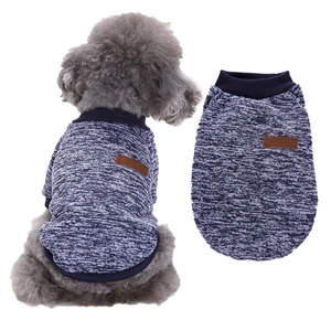 Detail of navy knit dog sweater featuring classic leather patch and ribbed texture