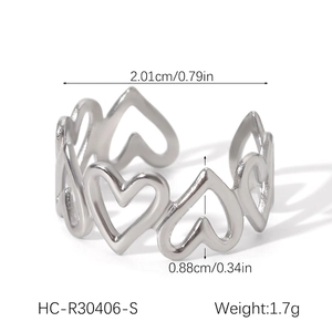 Detailed view of hollow heart patterns on a stainless steel ring with dimensions shown