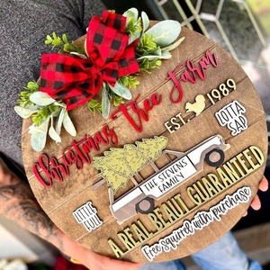 Customized wooden Christmas tree farm door sign with red buffalo plaid bow and greenery