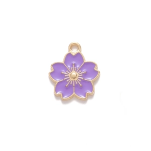 Detail of purple cherry blossom pendant with gold metal edges and enamel finish