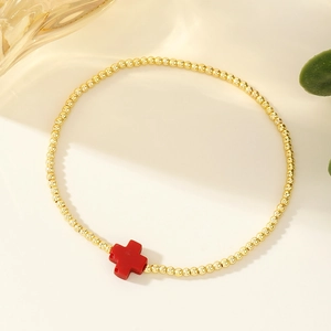 Bracciale a sfere in oro 18 carati con ciondolo a croce rossa per un look classico