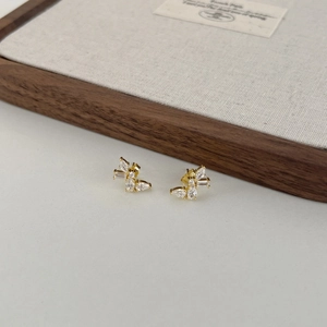 Detailed view of S925 silver butterfly earrings with gold plating and zircons
