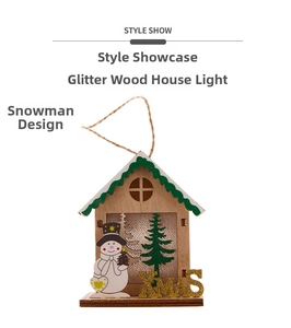 Detail view of a wooden Christmas house ornament with a snowman and XMAS lettering
