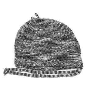 Detail of gray and white knit beanie featuring side earflap ties and textured stitching