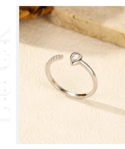 Detail of S925 sterling silver ring featuring a teardrop zircon and pavé diamond band