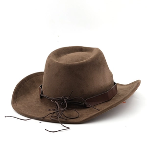 Detailed view of brown suede cowboy hat texture with leather band and stitching