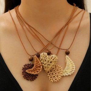 Bohemian woven pendant necklace set with wood beads and handmade raffia heart on brown cord
