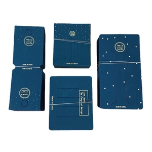 Set of dark blue paper jewelry display cards with handmade prints for necklaces and brooches