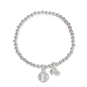 Silver beaded bracelet with tassel and fortune cat pendant on white background