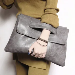 Large gray PU leather clutch bag with handle cutout and spacious vintage style design