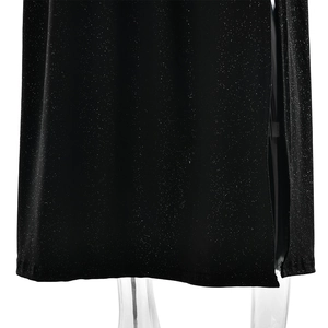 Detailed close-up of a sparkling black dress showing the elegant side slit and fabric texture