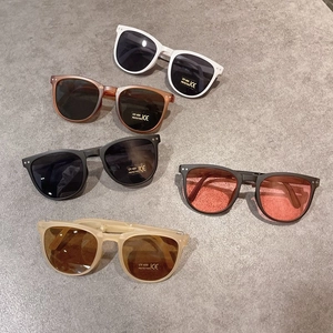 Flat lay of foldable kids sunglasses in various frame colors with UV400 protection
