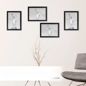 Detail of black minimalist wood frame showing vertical and horizontal hanging hooks