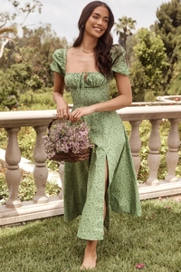 Detail of green floral puff sleeve dress with side slit and drawstring neckline