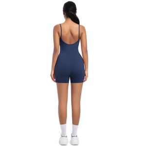 Detail of navy blue backless athletic playsuit with cross straps and high elasticity
