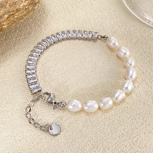 Detail of freshwater pearl and cubic zirconia chain bracelet with a lobster clasp closure