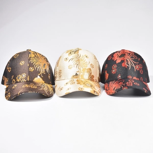 Three Chinese-style embroidered baseball caps in bronze, gold, and black satin fabric