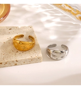 Detail of adjustable star rings with zircon inlay and vintage gold finish plating