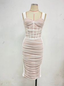 Detail of pink velvet and white mesh pleated party dress with corset boning